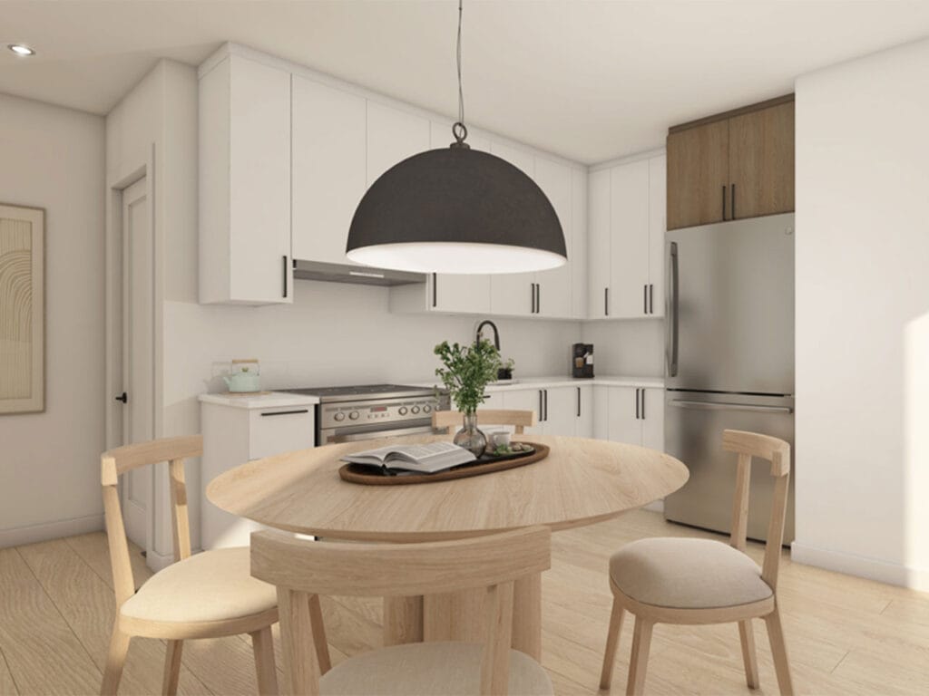 Cuisine ouverte d’un appartement du projet Desrosiers, table et suspension noire
