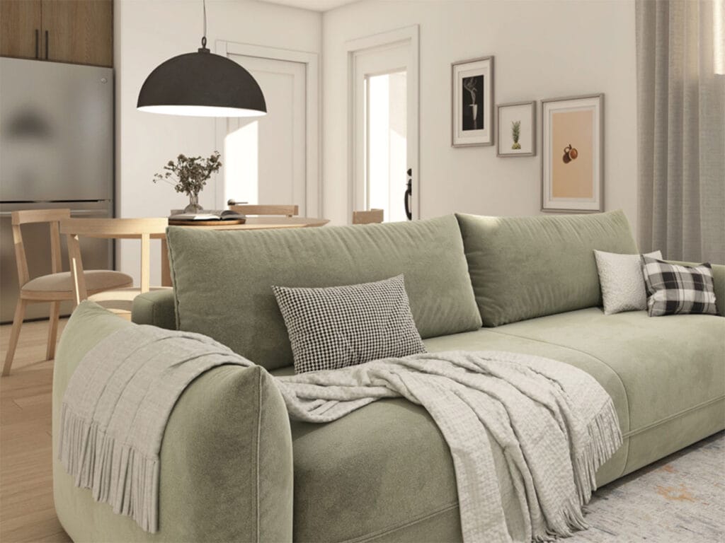 Salon d’un appartement du projet Desrosiers, canapé vert